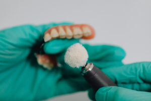 Dental lab repairing a denture